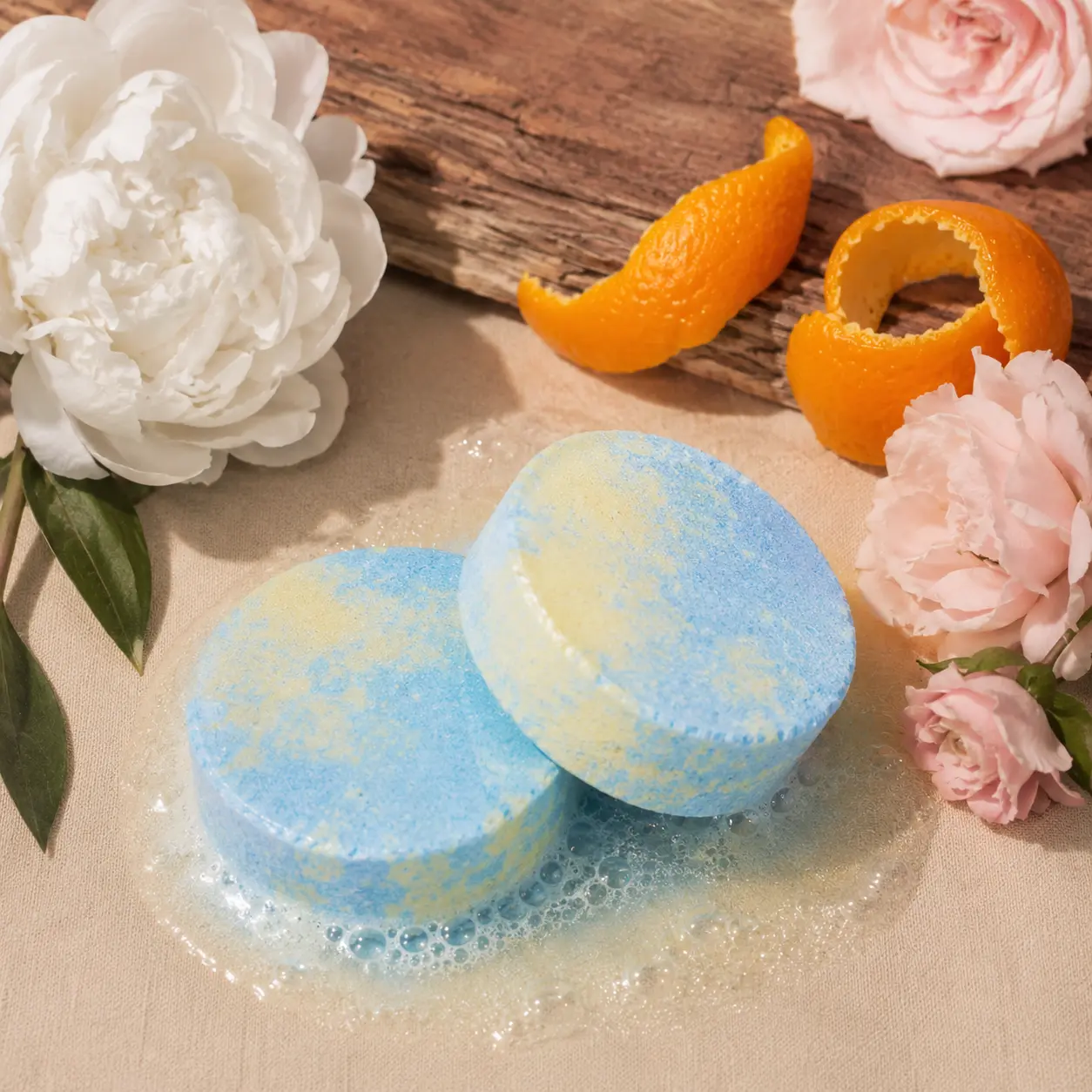 Holy Fizz Peony Musk Shower Steamer blue and yellow two pieces with white peony pink roses and orange peel soft feminine aromatherapy