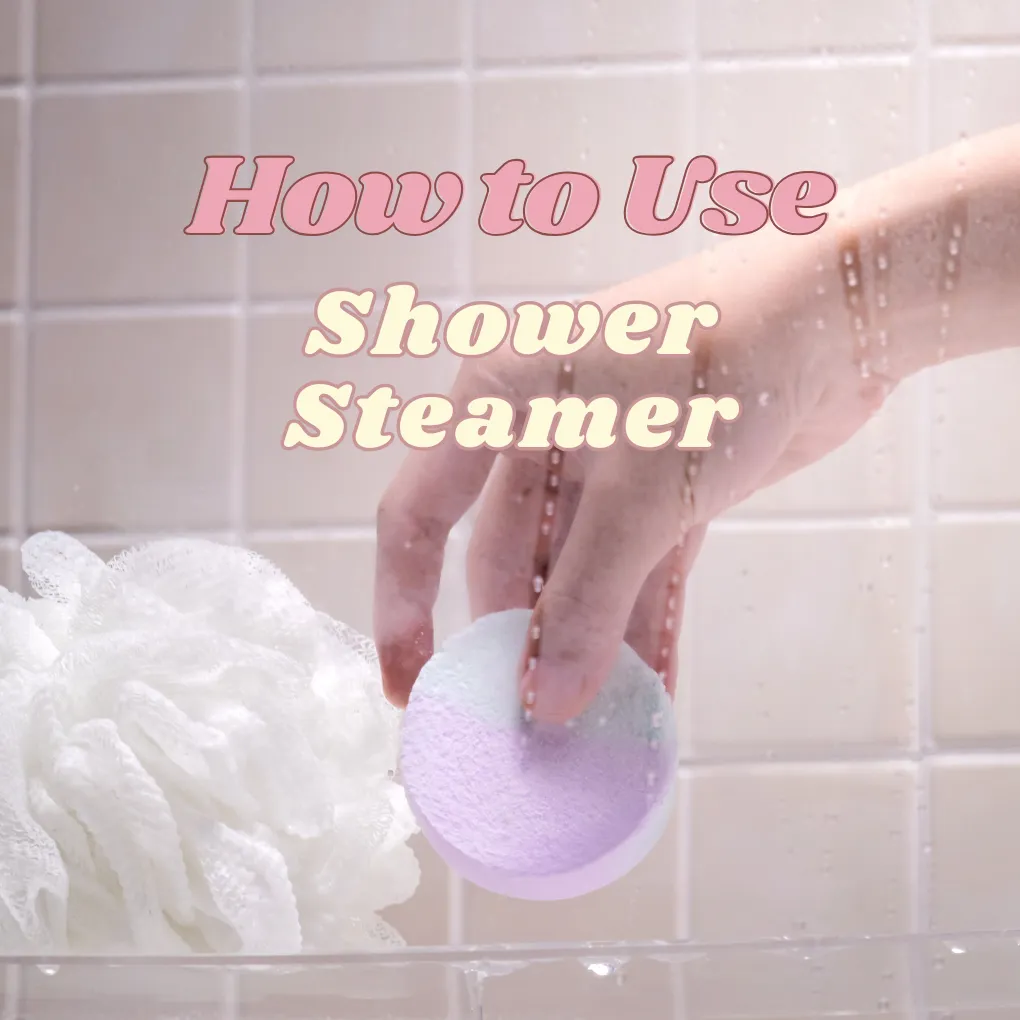 Hand placing a purple Holy Fizz shower steamer on a shower ledge beside a loofah, titled How to Use Shower Steamer.