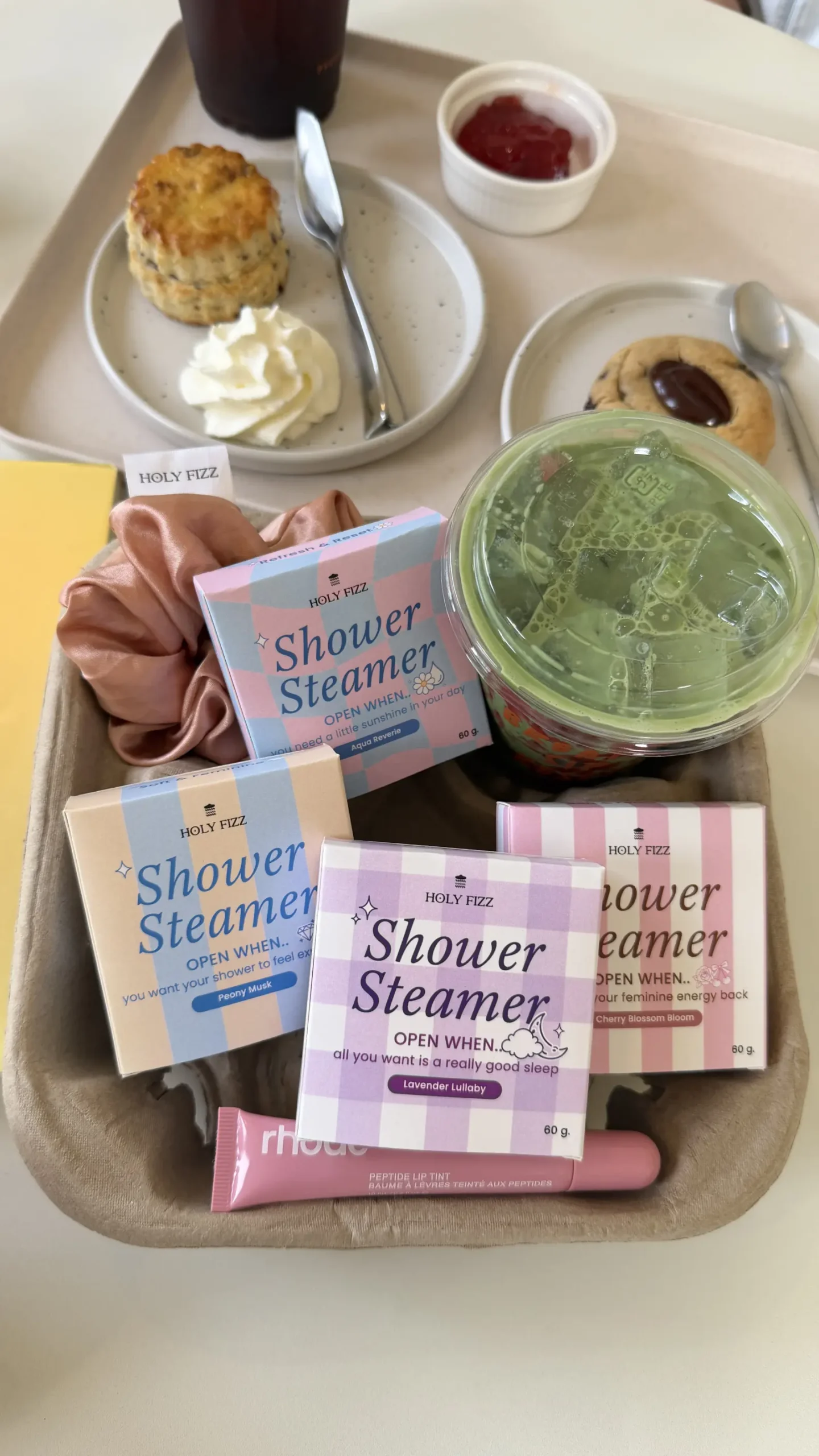 Holy Fizz shower steamers in multiple scents displayed with drinks and snacks lifestyle